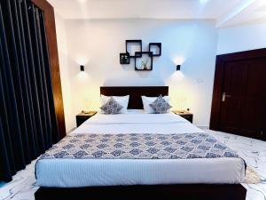 Postel nebo postele na pokoji v ubytování Aloe Transit Hotel