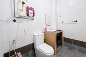 a bathroom with a white toilet and a shower at Homestay Taman U12, Shah Alam - Smarthome in Shah Alam +25 photos