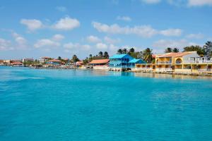 a large body of water with houses and buildings at Divi Flamingo Beach Resort in Kralendijk
