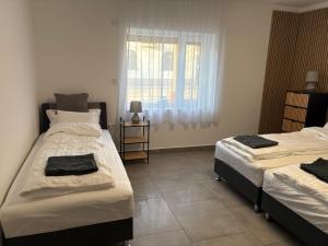 Postel nebo postele na pokoji v ubytování PP Apartman