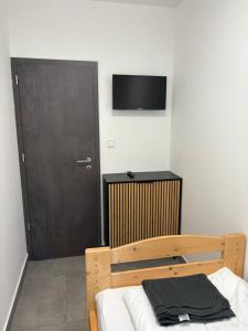 TV a/nebo společenská místnost v ubytování PP Apartman