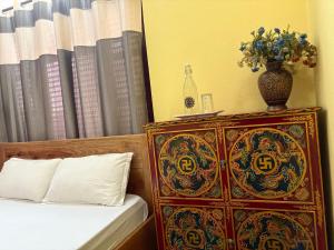 Letto o letti in una camera di DRAKON NEST HOMESTAY
