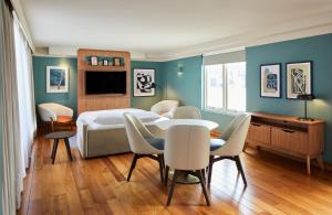 a bedroom with a bed and a table and chairs at master Farringdon in London