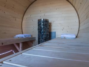 a sauna with two beds and a wine rack at Studio Apartment - Villa Taternik in Zakopane