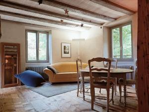 Χώρος καθιστικού στο Gîte de charme classé 3 étoiles dans ferme du XIXe restaurée