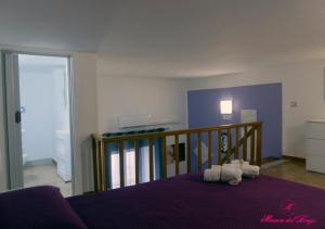 En eller flere senge i et værelse på Casa Vacanza Vieste In Centro - Maison del Borgo