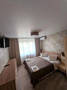 Кровать или кровати в номере Cazare Apartamente IRIS +23 фотографии