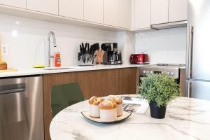 een keuken met een tafel met wat eten erop bij 149BK-302 New Construction 1BR WD in unit Balcony in Brooklyn