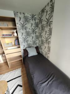 Posteľ alebo postele v izbe v ubytovaní Agréable Appartement avec Balcon