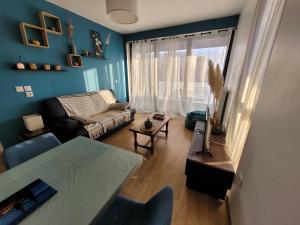 Posedenie v ubytovaní Agréable Appartement avec Balcon