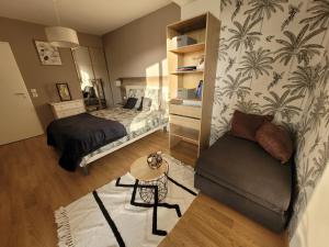 Posteľ alebo postele v izbe v ubytovaní Agréable Appartement avec Balcon