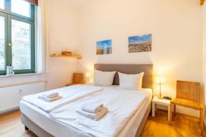 Postel nebo postele na pokoji v ubytování Villa Goodewind + 9 fotografií