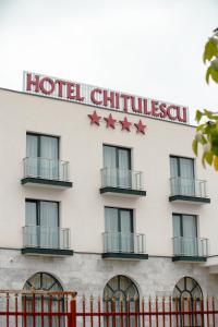 a hotel building with red stars on it at CHITULESCU Hotel in Târgovişte