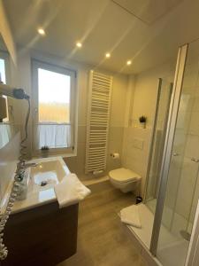a bathroom with a sink and a shower and a toilet at Gartenlaube Marburg in Marburg an der Lahn +80 photos