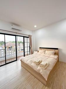 Postel nebo postele na pokoji v ubytování Luxsabai home