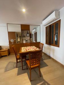 a dining room with a table and chairs at Baan Poo Lom Condo in Hua Hin