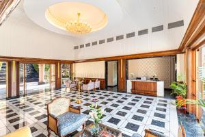 a living room with a chandelier and a lobby at Sayaji Resorts & Spa Udaipur in Udaipur