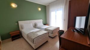 TV a/nebo společenská místnost v ubytování Easy Green Hotel