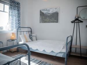 a bedroom with a bed and a picture on the wall at Ferienhaus Emma in Kramerhof