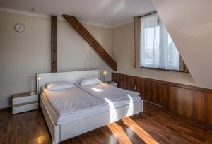 Postel nebo postele na pokoji v ubytování Dobosi Vendégház