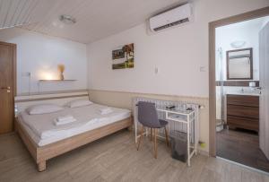Postel nebo postele na pokoji v ubytování Dobosi Vendégház