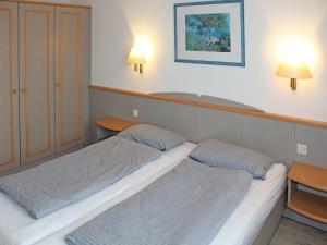 Postel nebo postele na pokoji v ubytování Ferienhaus Nr 53, Kategorie Komfort, Feriendorf Hochbergle, Allgäu