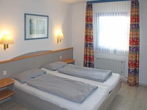 Postel nebo postele na pokoji v ubytování Ferienhaus Nr 53, Kategorie Komfort, Feriendorf Hochbergle, Allgäu