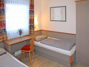 Postel nebo postele na pokoji v ubytování Ferienhaus Nr 53, Kategorie Komfort, Feriendorf Hochbergle, Allgäu + 11 fotografií