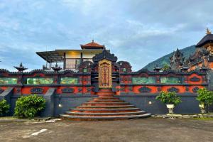 a stairway leading up to a building with a building at Munduk Luwih Ecolodge Bedugul by AGATA in Bedugul