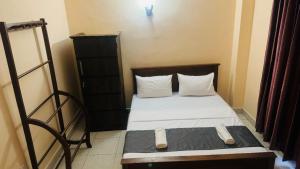 Postel nebo postele na pokoji v ubytování TASHINI Hotel