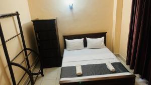 Postel nebo postele na pokoji v ubytování TASHINI Hotel
