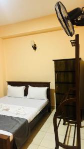 Postel nebo postele na pokoji v ubytování TASHINI Hotel