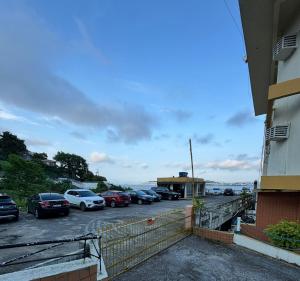 a bunch of cars parked in a parking lot at Hotel Veleiro in Florianópolis