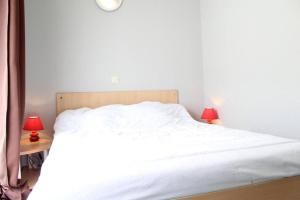 En eller flere senge i et værelse på Appt 2 pièces LA ROCHELLE - LR030-C115