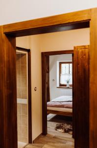 Postel nebo postele na pokoji v ubytování Apartmány Lešovice