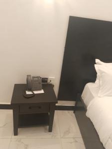 Postel nebo postele na pokoji v ubytování WATER PavilioN HOTEL