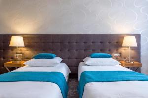Posteľ alebo postele v izbe v ubytovaní Tulip Hotels - Wroclaw Patio