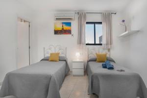 Ένα ή περισσότερα κρεβάτια σε δωμάτιο στο Hostal Avenida