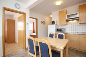 Kuchyňa alebo kuchynka v ubytovaní Apartments Mikulan Nara