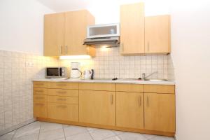 Kuchyňa alebo kuchynka v ubytovaní Apartments Mikulan Nara