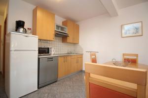 Kuchyňa alebo kuchynka v ubytovaní Apartments Mikulan Nara