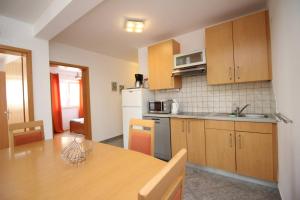 Kuchyňa alebo kuchynka v ubytovaní Apartments Mikulan Nara
