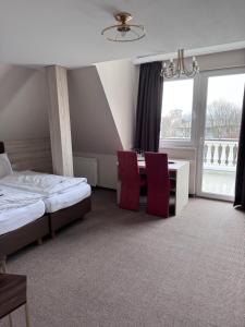 Postel nebo postele na pokoji v ubytování Hotel Villa am Waldschlösschen