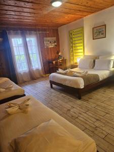 Rúm í herbergi á Hotel Des Neiges