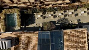 a building with plants on the side of it at Sant Jaume Design Hotel in Palma de Mallorca
