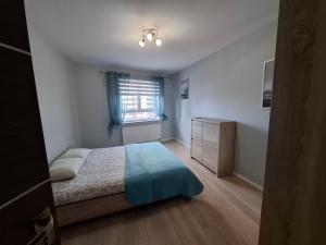 Ένα ή περισσότερα κρεβάτια σε δωμάτιο στο Tauzen Apartaments 216