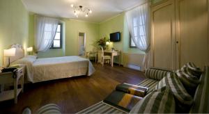 Postel nebo postele na pokoji v ubytování Relais Corte Cavalli