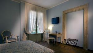 Postel nebo postele na pokoji v ubytování Relais Corte Cavalli