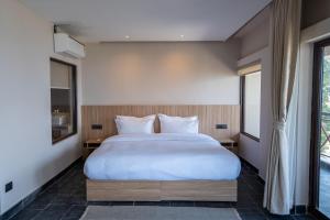 Letto o letti in una camera di Nana Mountain Resort