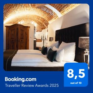 a hotel room with a large bed with a large ceiling at Historical Luxury Homes - Luxus Suite Colloseum in Freiburg im Breisgau
